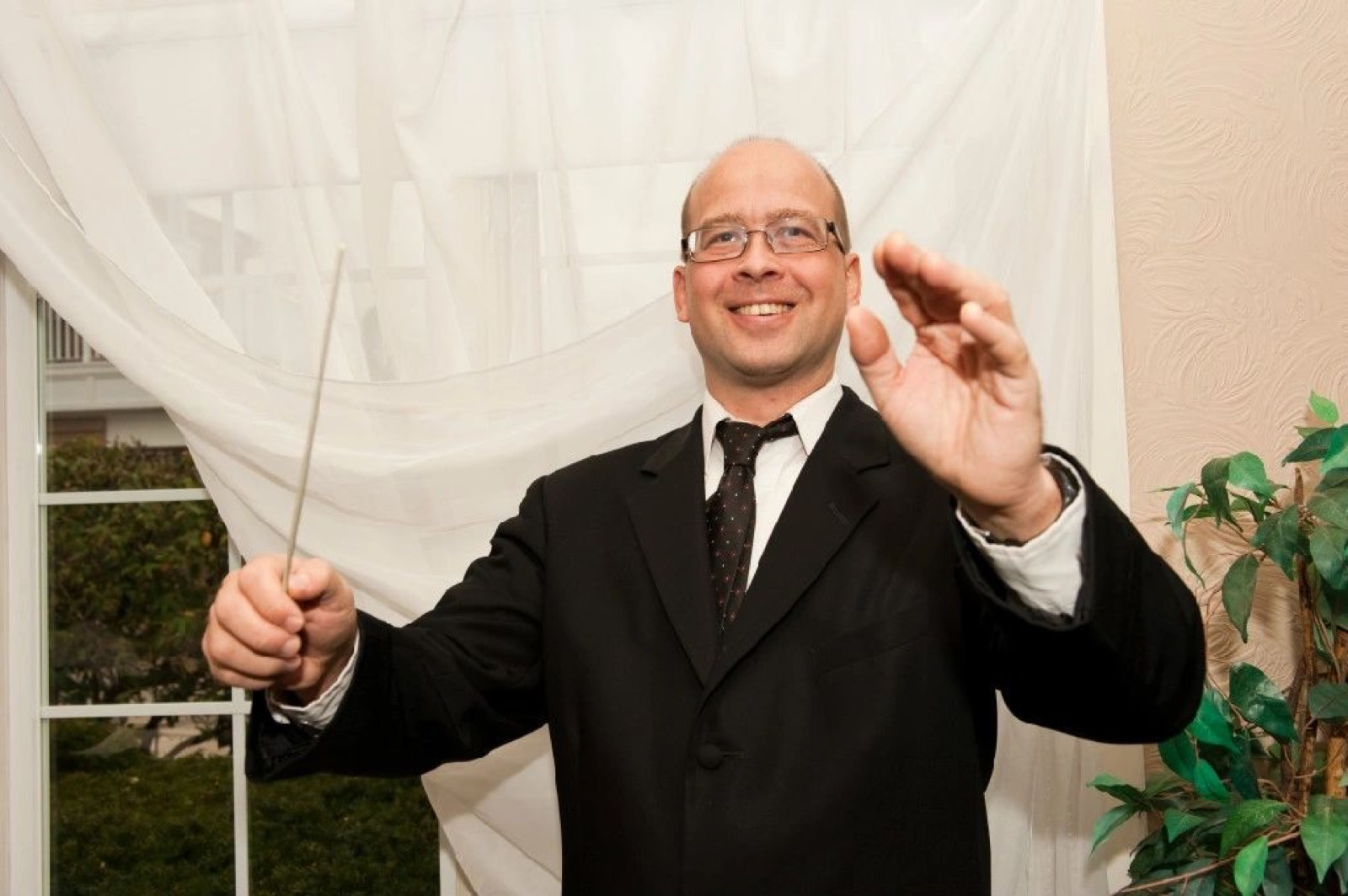 Conductor George Cleland directing the orchestra